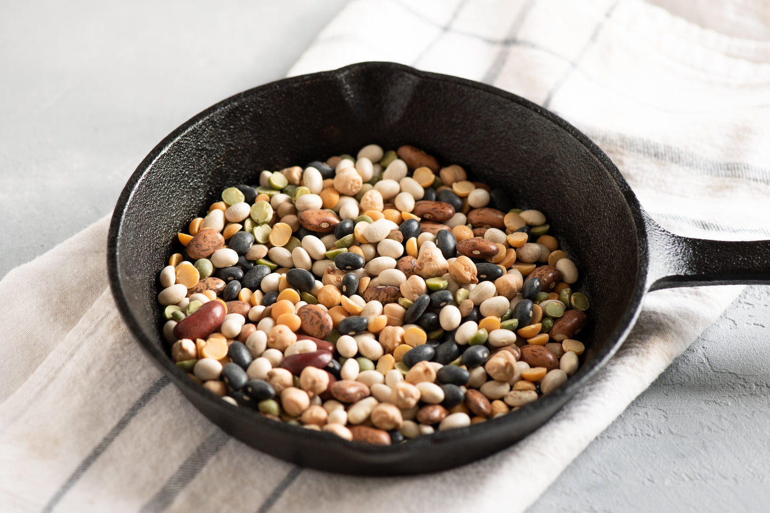 raw beans in cast iron pan